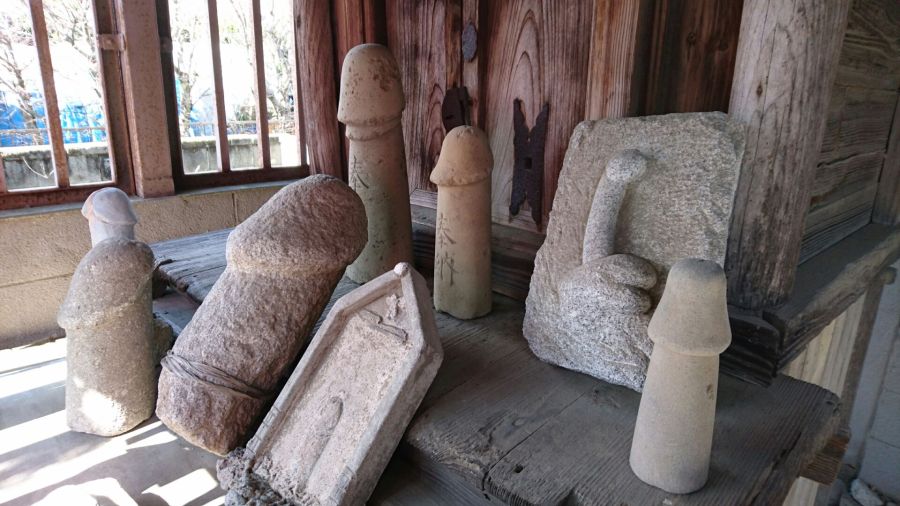 Phallic carvings left at the shrine as offerings.